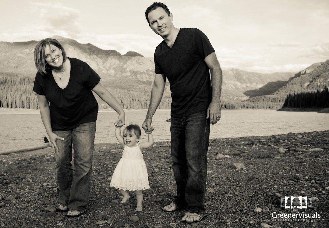 young-family-walks-holding-daughters-hands-Hyalite-Reservoir-Family-Portrait