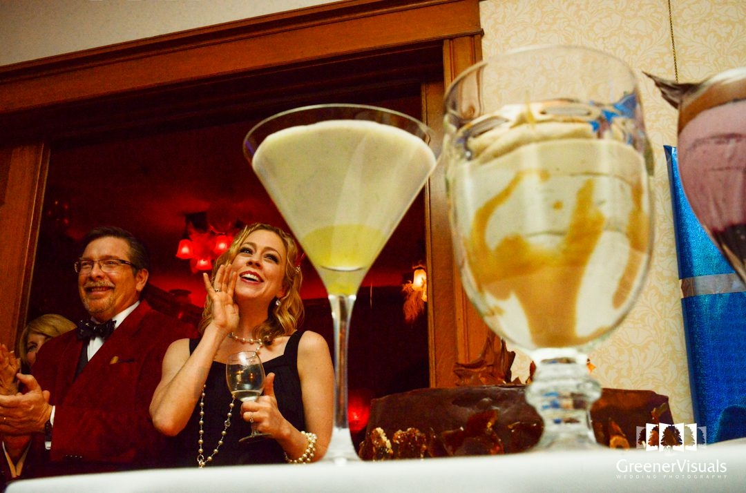 fancy-drinks-and-woman-cheering-at-Story-Mansion-Christmas-Party