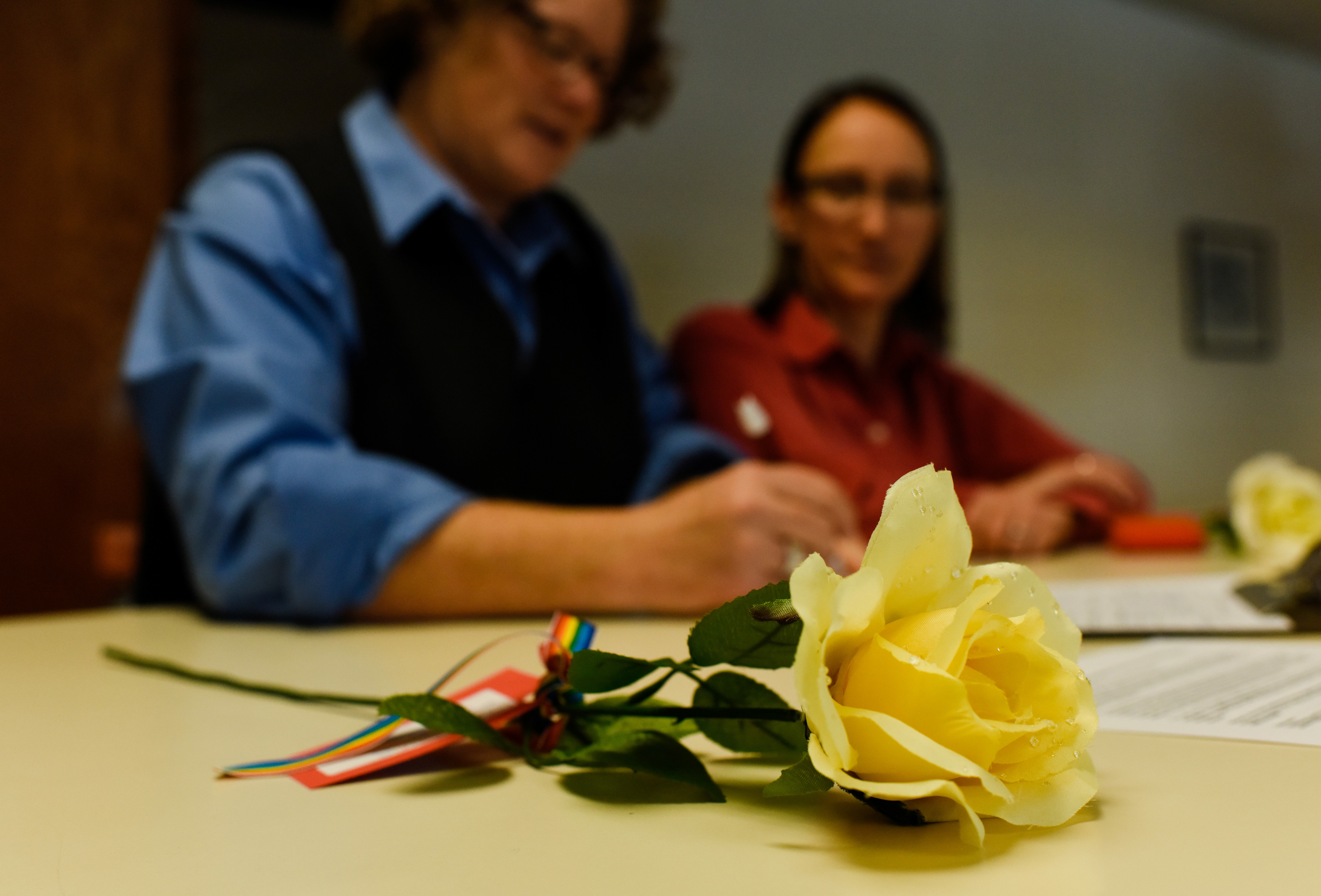 yellow-rose-while-signing-marriage-license