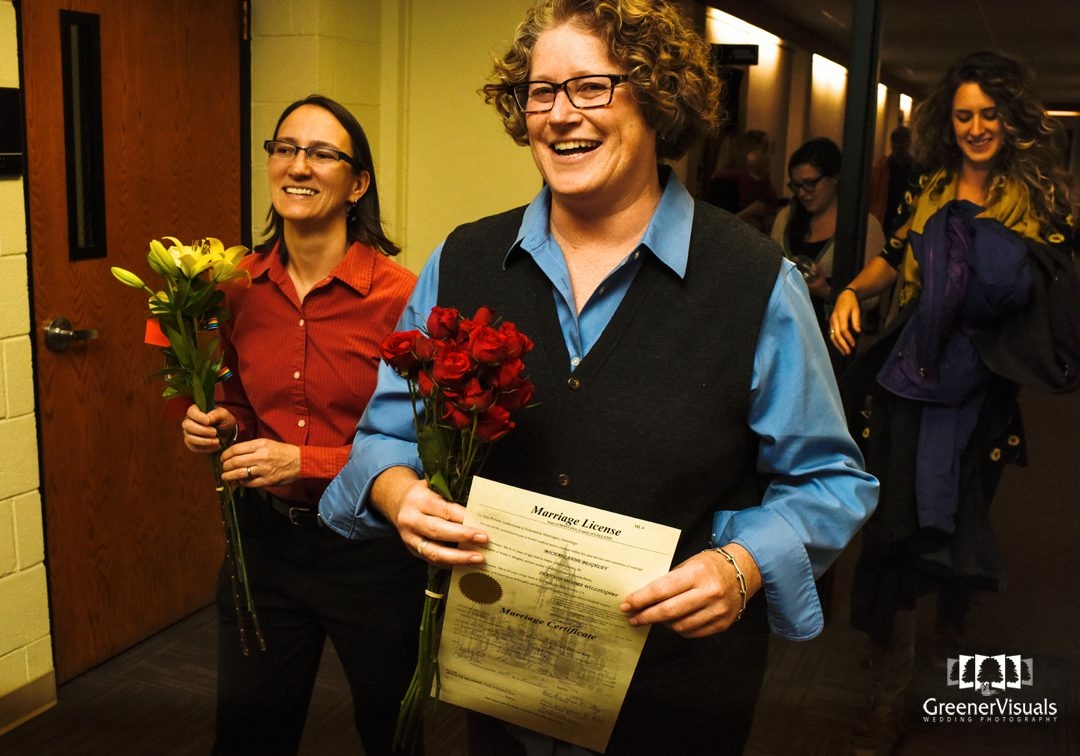 wedding-couple-walk-to-ceremony-during-same-sex-court-marriage-of-michaelanne-and-shannon