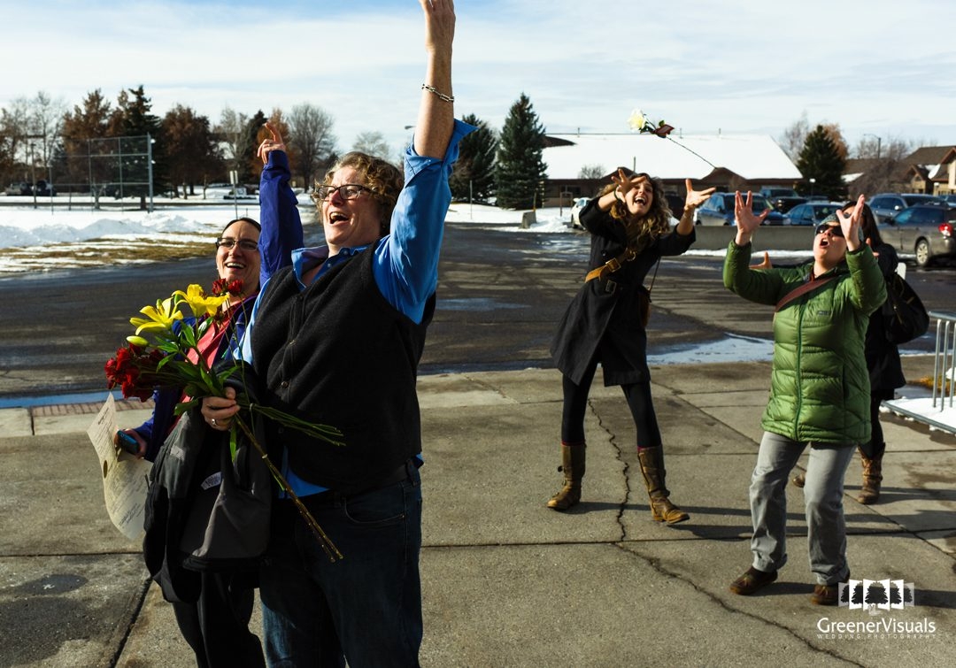 double-bouquet-toss-in-courthouse-parking-lot-same-sex-court-marriage-of-michaelanne-and-shannon