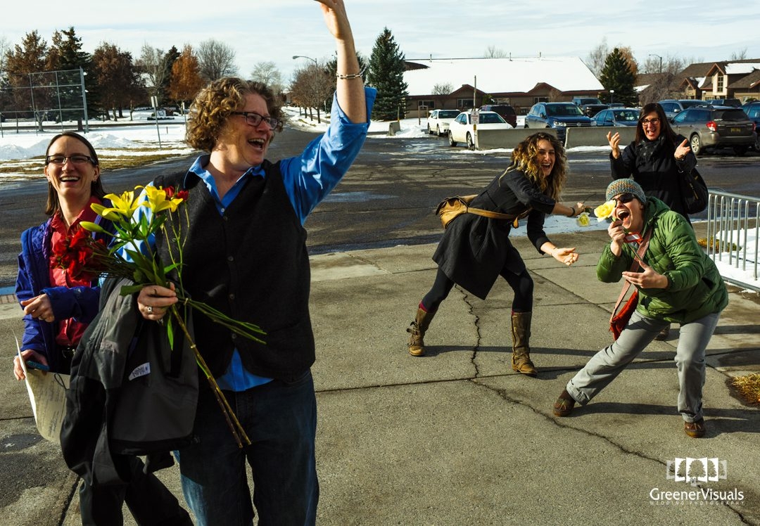 double-bouquet-toss-catch-in-courthouse-parking-lot-same-sex-court-marriage
