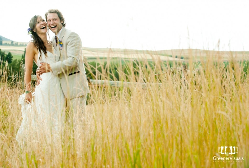 newlyweds-laughing-in-golden-mountain-field-Best-of-2014-Wedding