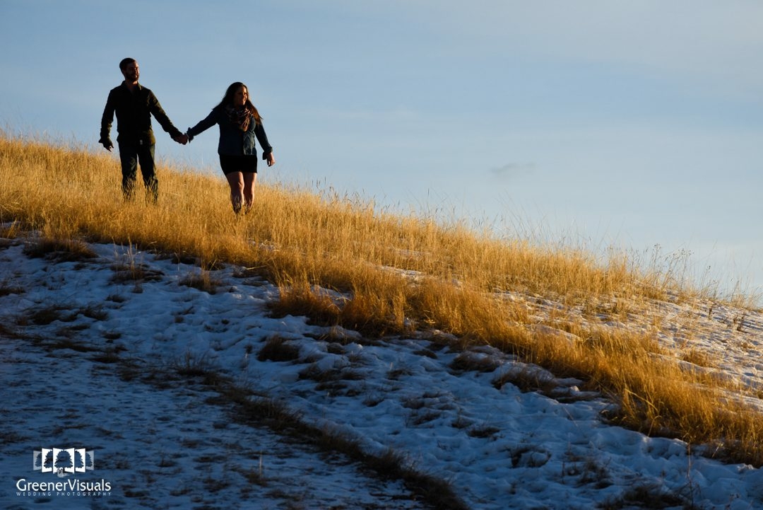 couple-holding-hands-at-sunset-Story-Mill-Park-Winter-Engagement-Portrait
