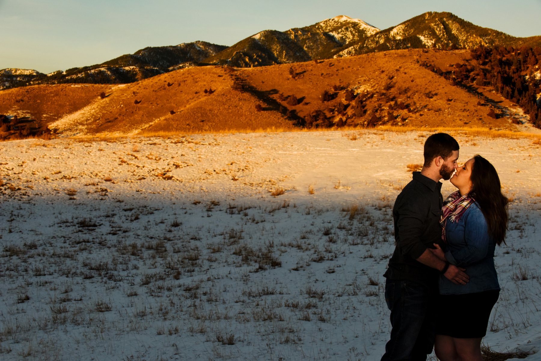 Sunset-kiss-couple-during-Story-Mill-Park-Winter-Engagement-Portrait