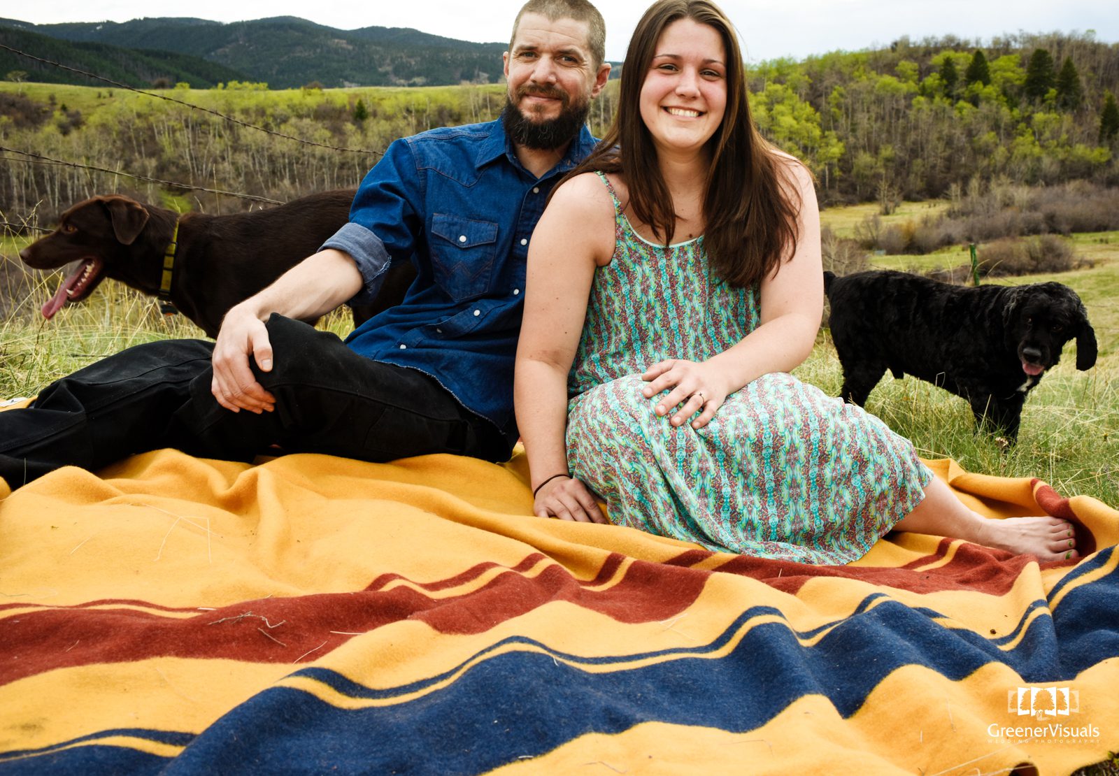engaged-couple-cuddle-on-pendleton-blanket-during-Triple-Tree-Trail-Engagement