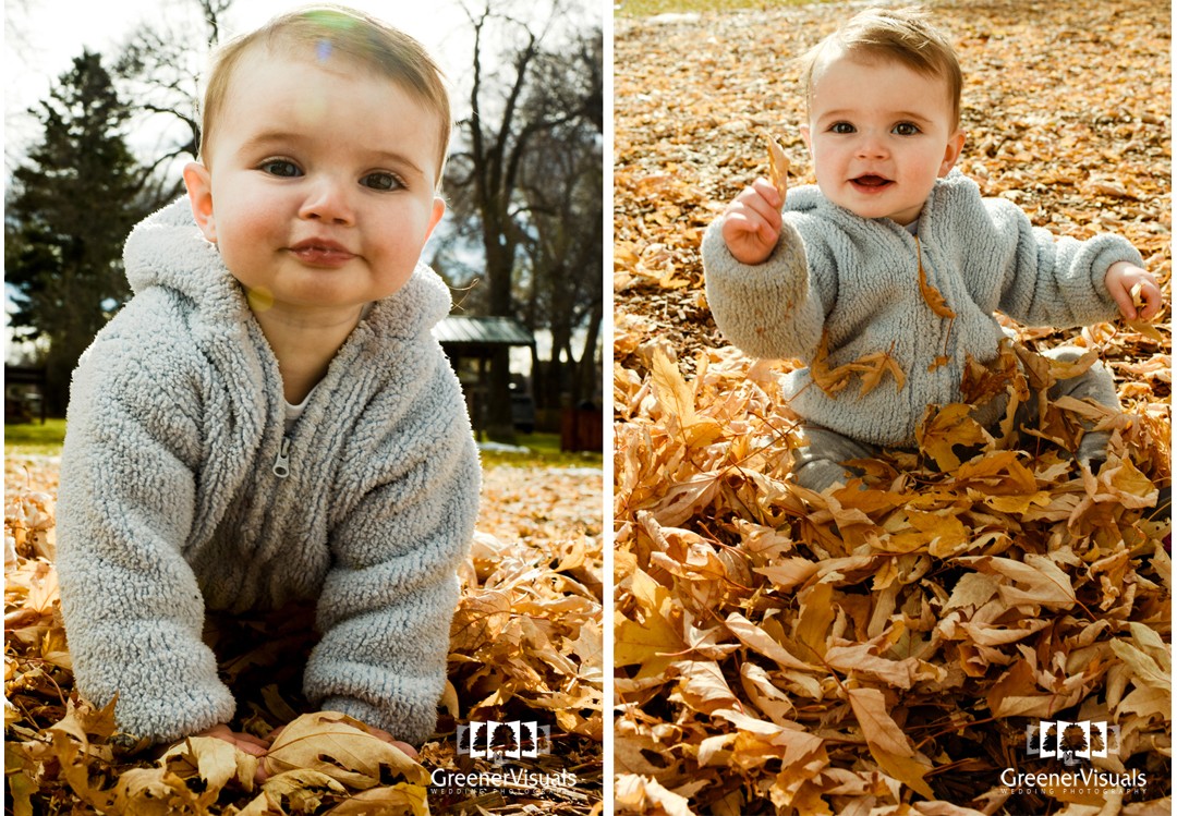 Toddler-smiling-playing-in-leaves-during-toddler-Fall-Family-Portraits