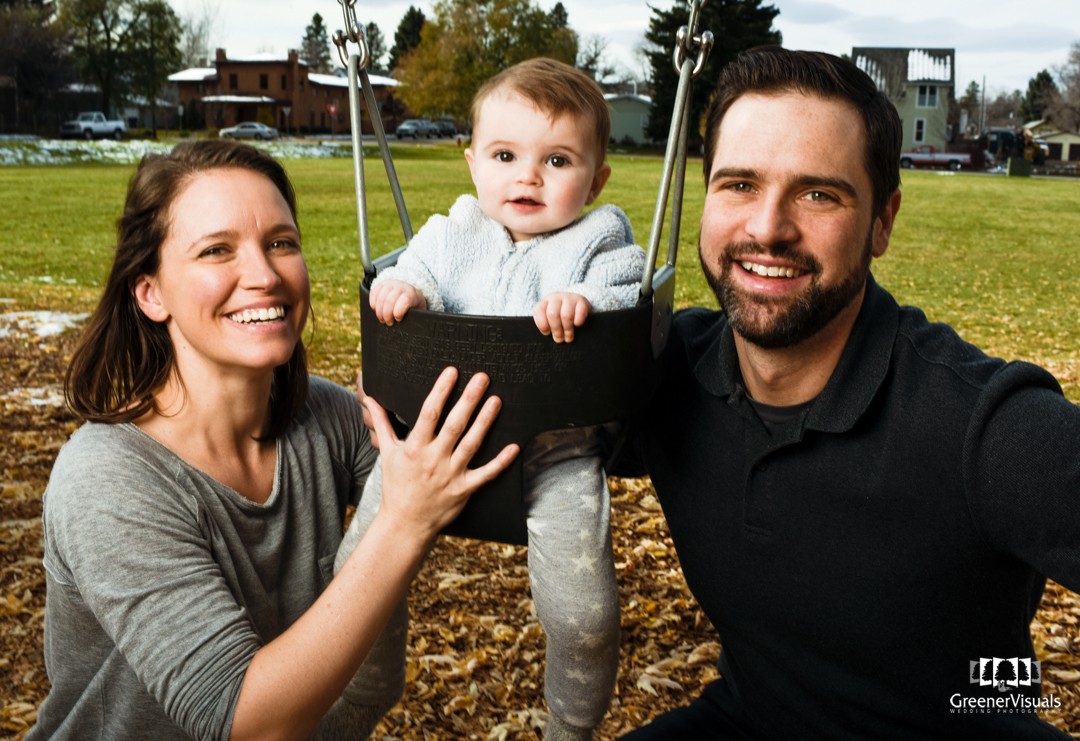 parents-with-daughter-on-swings-during-toddler-Fall-Family-Portraits