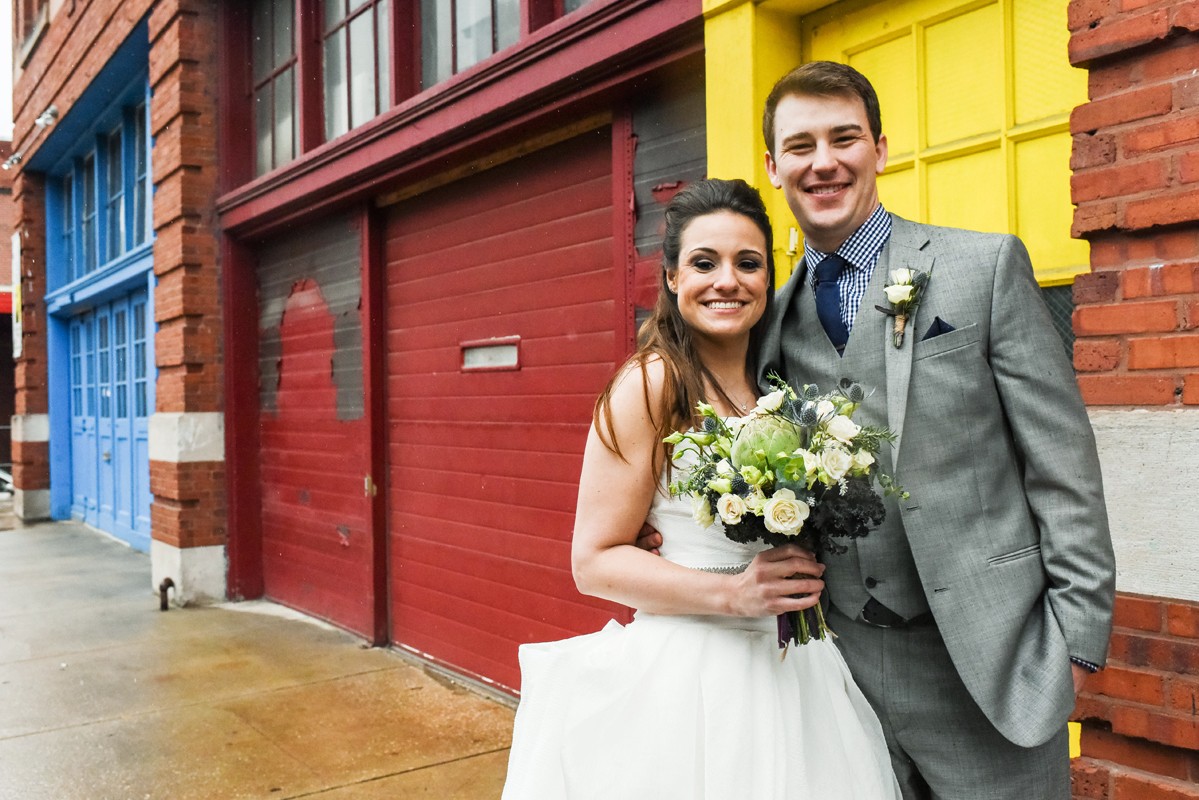 newlyweds-portrait-in-front-of-primary-color-background