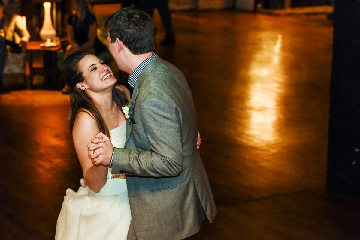 couple-first-dance-smiles-at-Chicago-Salvage-One-Wedding