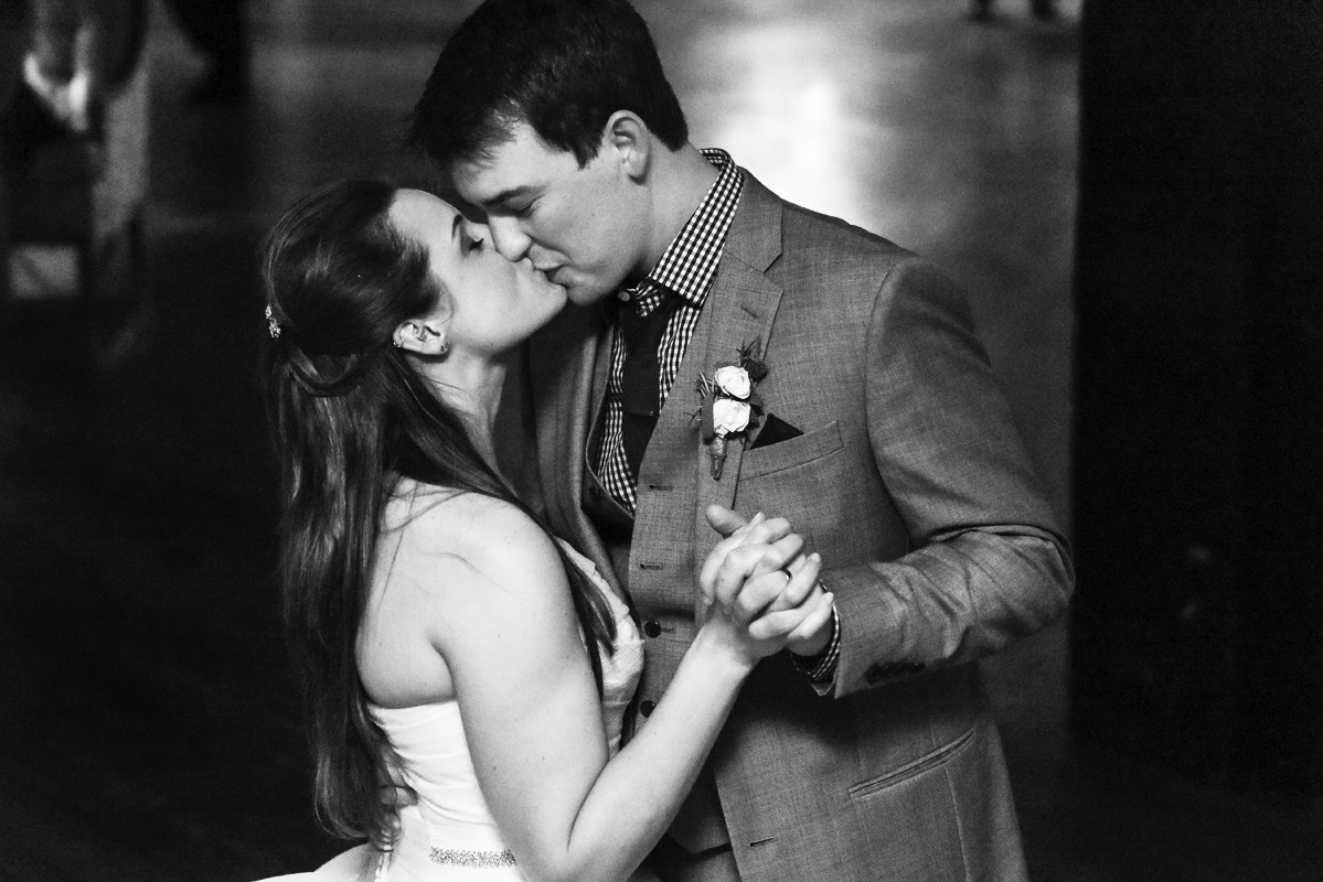 bride-and-groom-kiss-on-dancefloor-during-Chicago-Salvage-One-Wedding