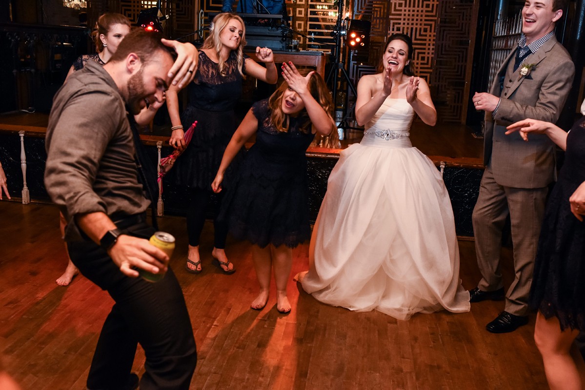 bride-celebrates-with-wedding-guests-Chicago-Salvage-One-Wedding
