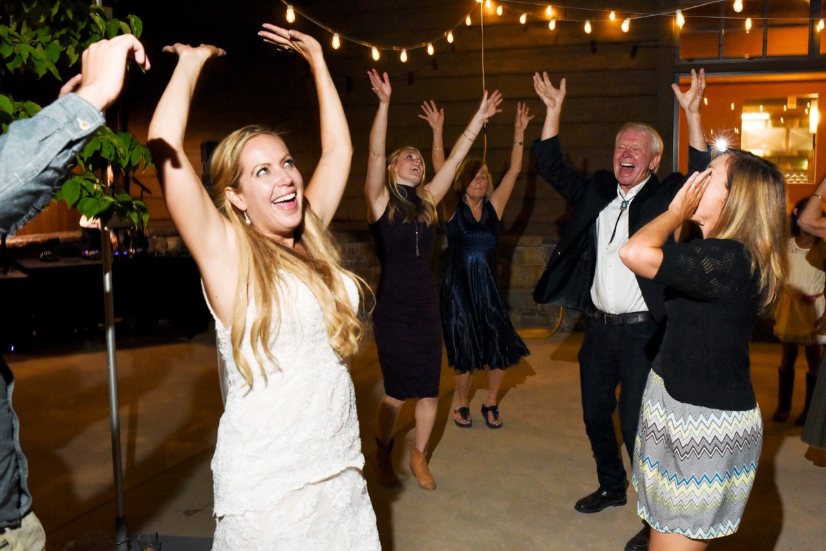 bride-sings-with-guests-at-Whitefish-Mountain-Resort-Wedding-reception