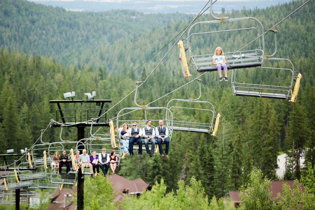 guests-ride-chairlifts-to-mountain-top-ceremony-during-Whitefish-Mountain-Resort-Wedding