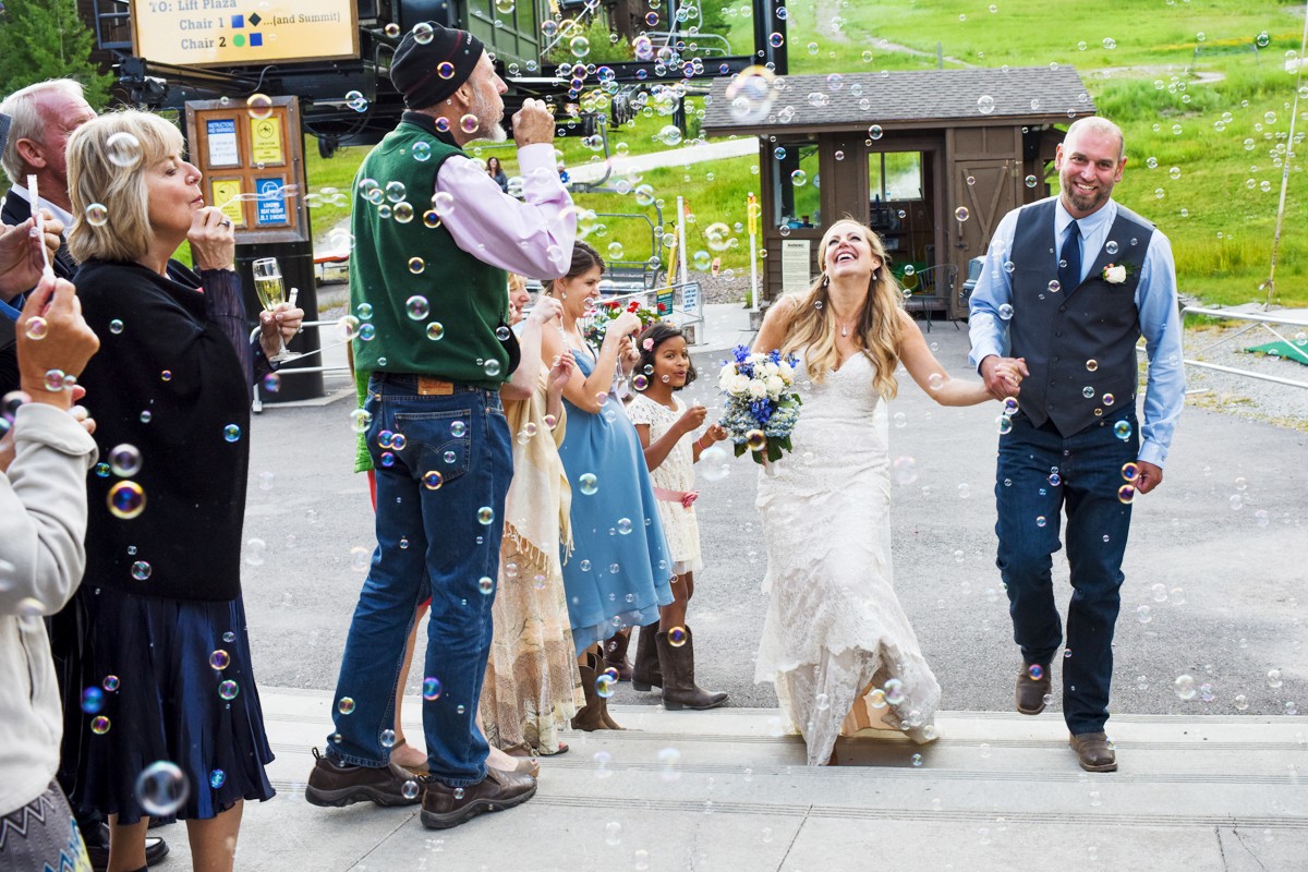 bride-and-groom-bubble-grand-entrance-at-Whitefish-Mountain-Resort-Wedding-reception