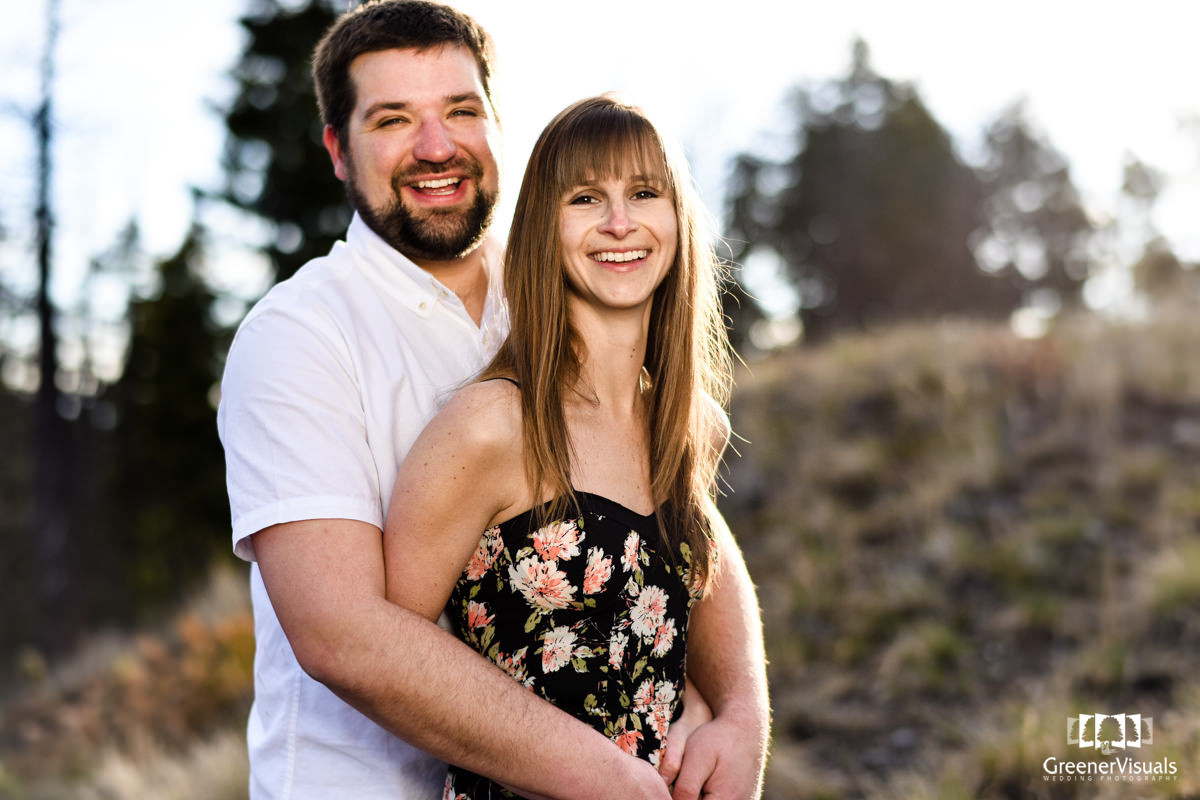 laughing-engaged-couple-on-Mount-Helena-Montana-Engagement-Portraits