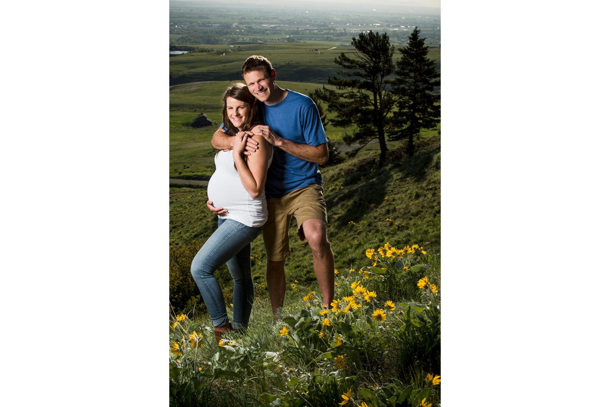 man-hugs-pregnant-wife-during-their-Bozeman-Maternity-Family-Portraits-session