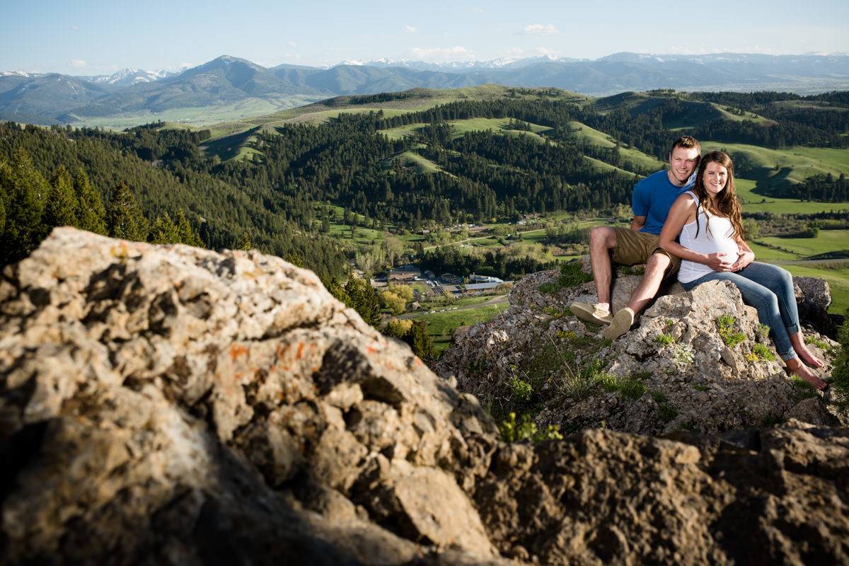 couple-with-mountainous-backdrop-during-Bozeman-Maternity-Family-Portraits-session