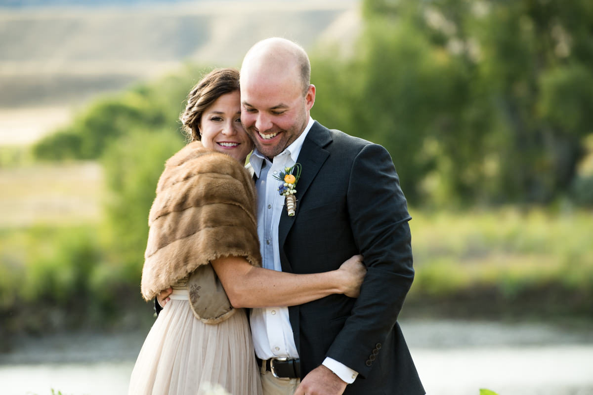 Yellowstone River wedding couple embrace smile