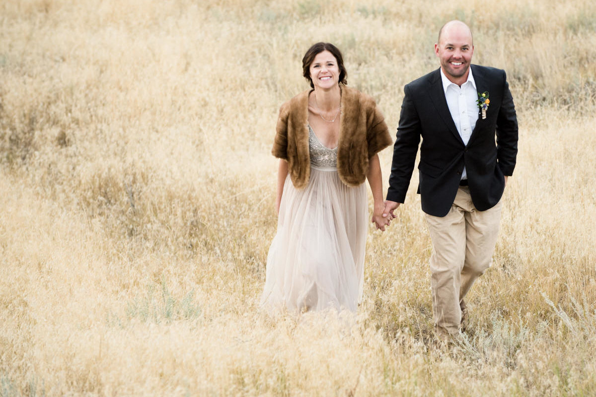 Yellowstone River wedding couple walk smile