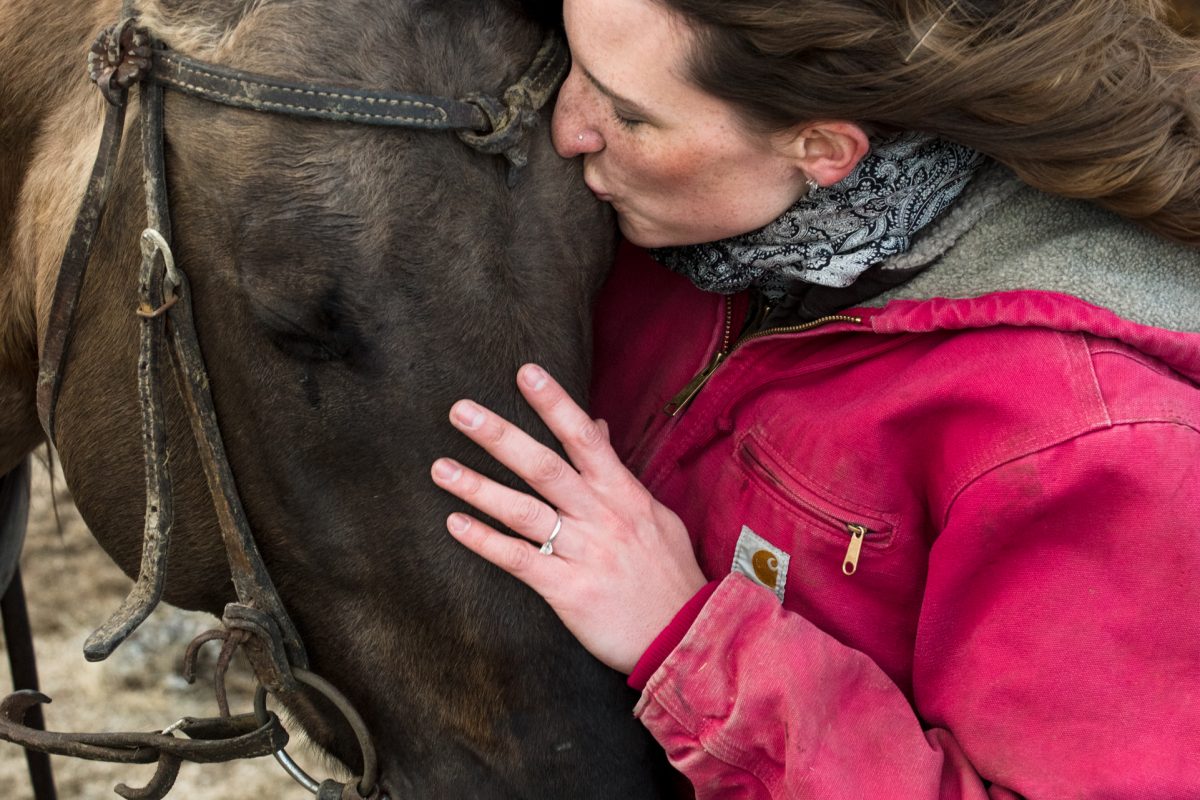 engaged-bride-kisses-horse-during-Horseback-Riding-Engagement-Portraits