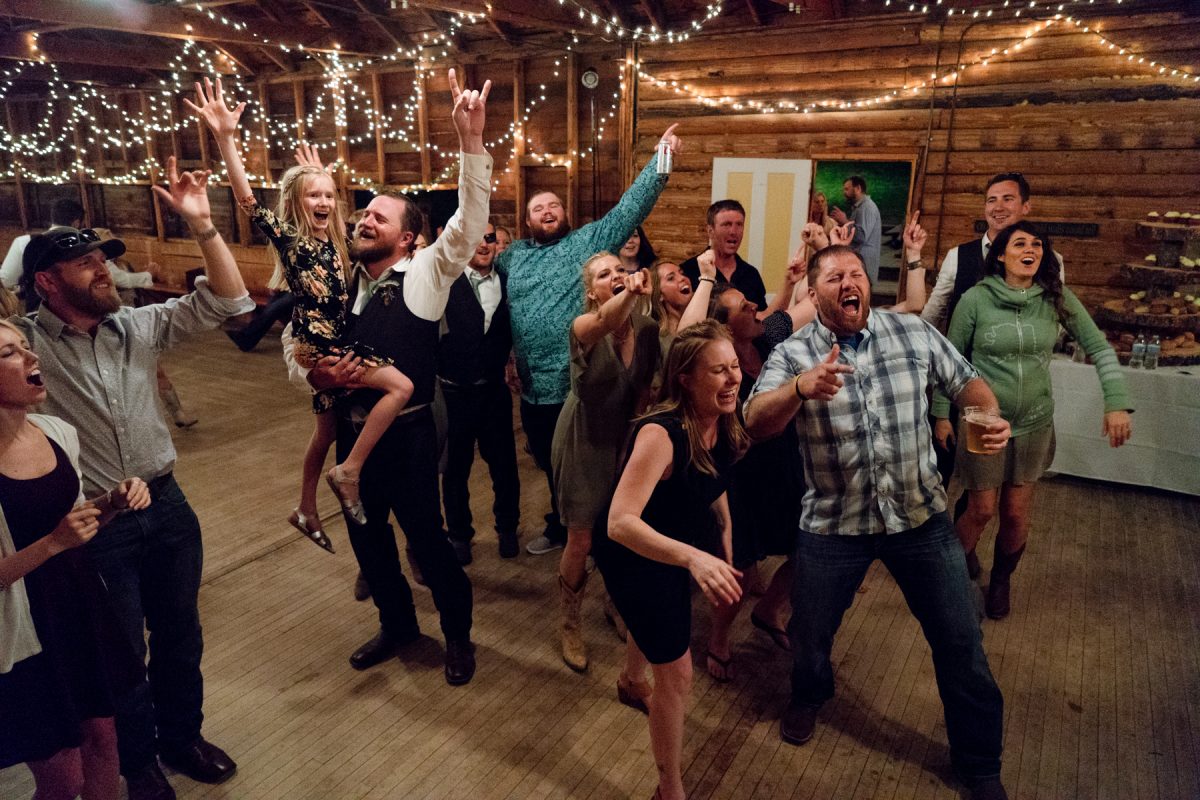 wedding-guests-laughing-together-at-Springhill-Pavillion-mountain-wedding