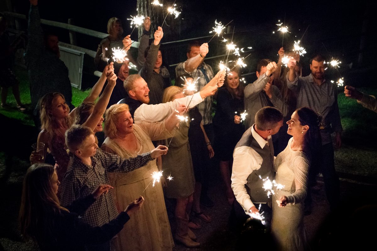 wedding-couple-sparkler-goodnight-kiss-at-Springhill-Pavillion-mountain-wedding