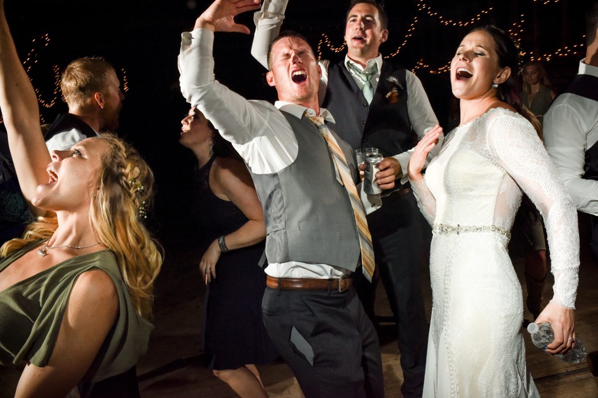 newlyweds-dance-and-sing-during-Springhill-Pavillion-mountain-wedding