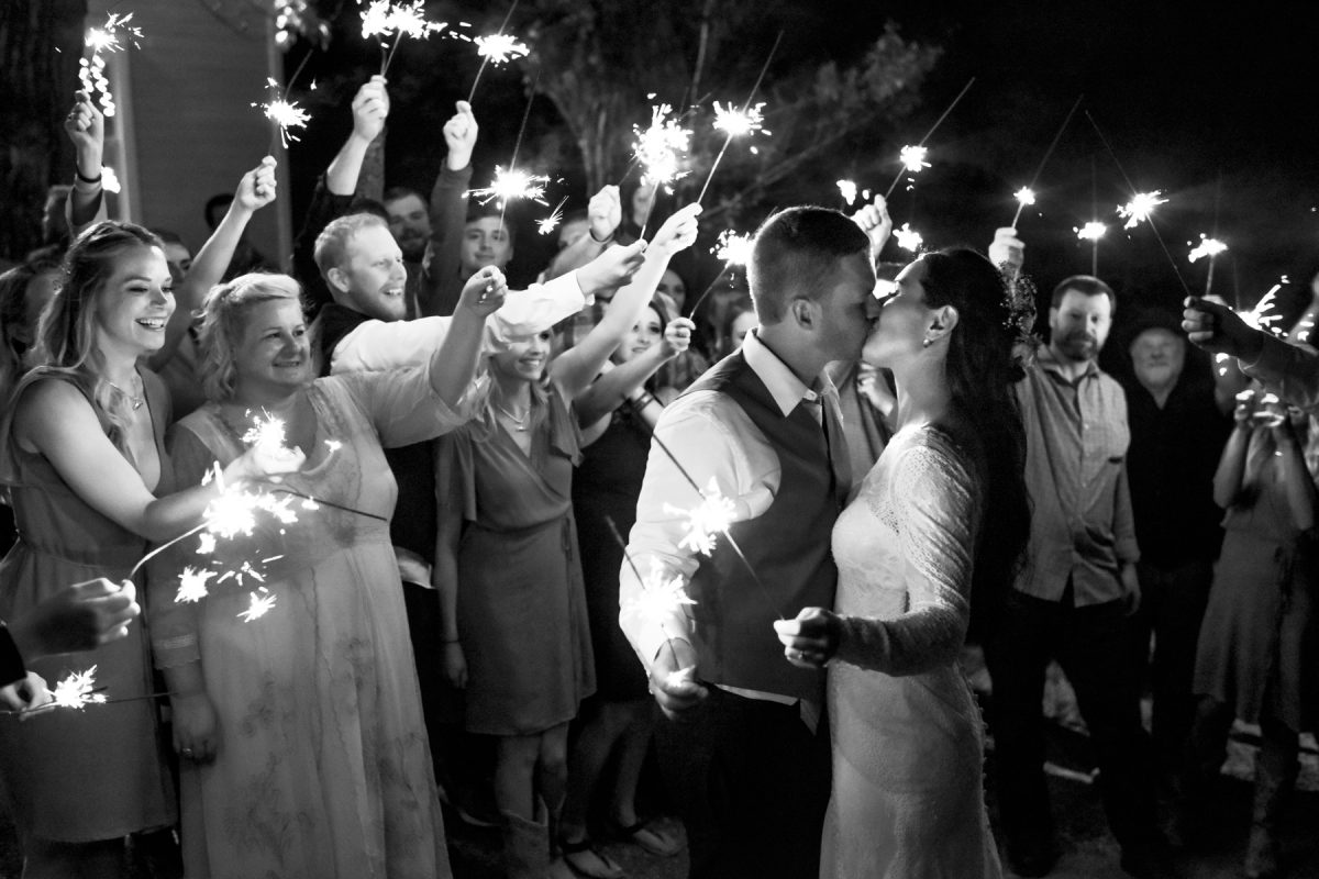 black-and-white-wedding-couple-sparkler-goodnight-kiss-at-Springhill-Pavillion-mountain-wedding