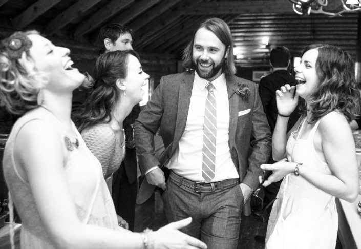 Montana Wedding Photographer Springhill Pavilion guests laugh