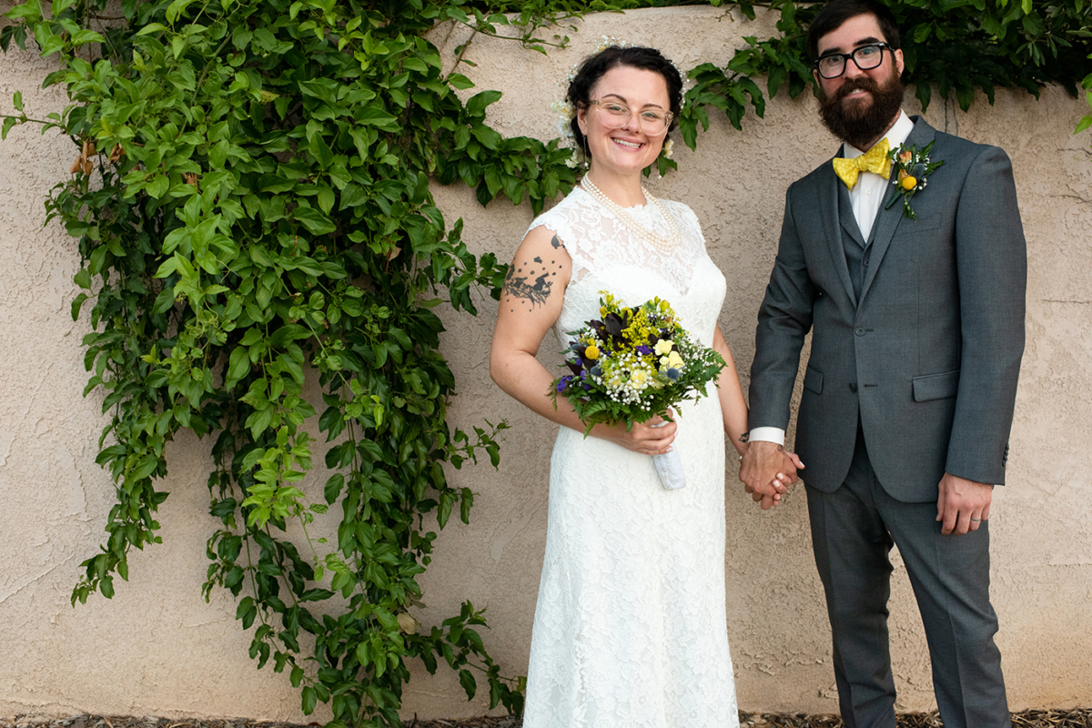 wedding-couple-against-ivy-wall-Murrieta-California-Destination-Wedding-Photographer