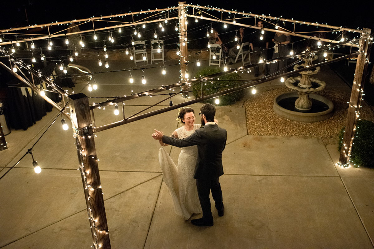 newlyweds-first-dance-under-lights-at-Murrieta-California-Destination-Wedding