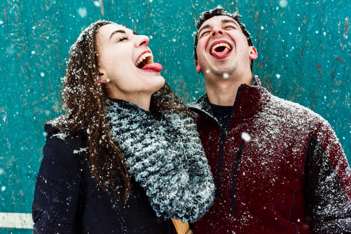 tongues-out-catching-snowflakes-couple-at-bogert-park-bozeman