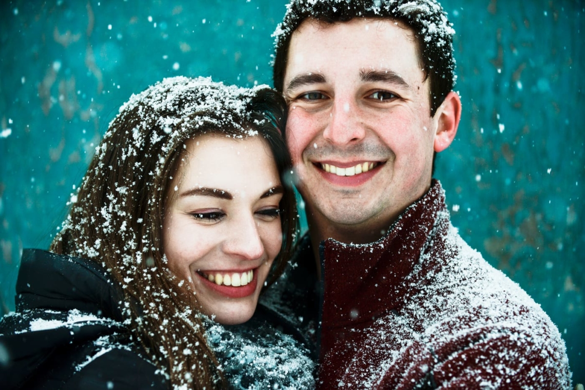 snowflakes-fall-on-engaged-couple