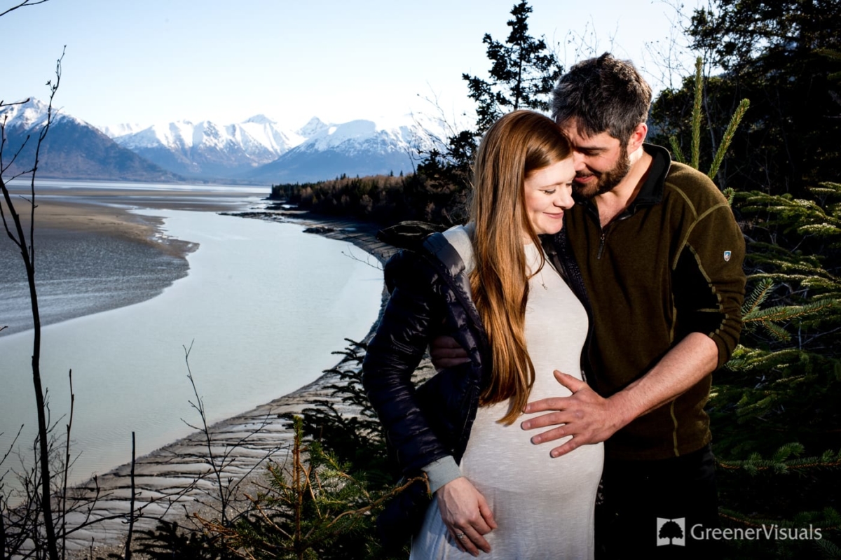 expecting-parents-embrace-over-sound-Alaska-Maternity-Portrait-Experience