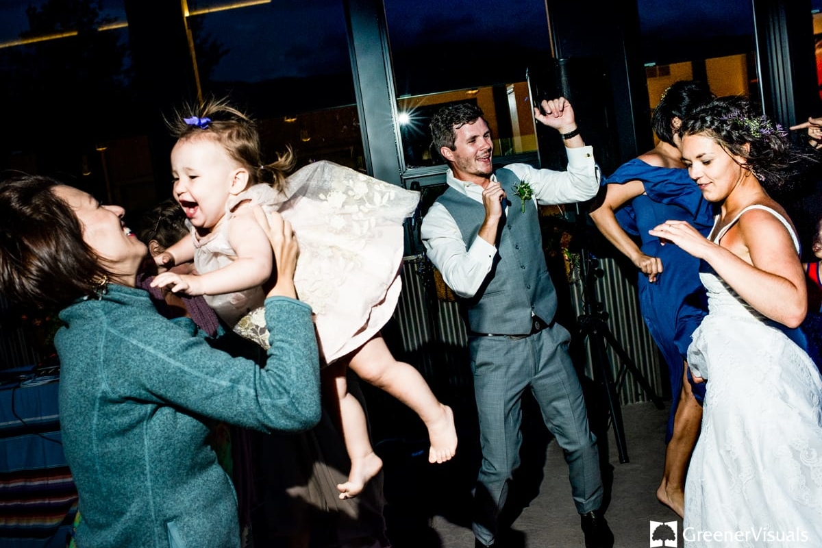groom-dances-with-guests-during-Countryside-Bozeman-Montana-Wedding
