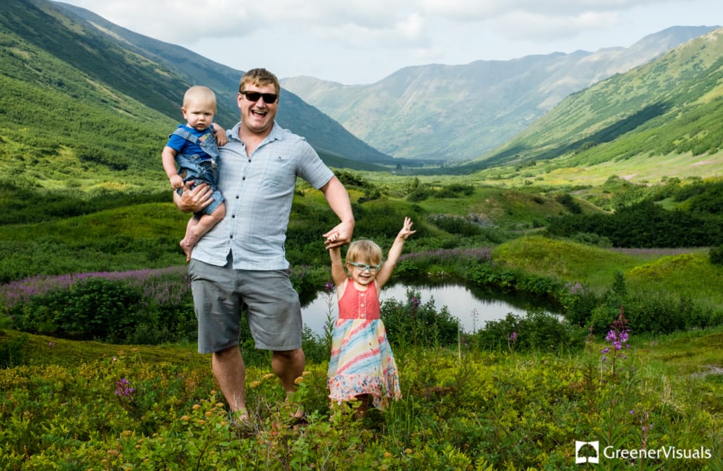 Father-with-his-children-in-green-mountain-meadow-Anchorage-Alaska-Destination-Family-Portrait-Photographer