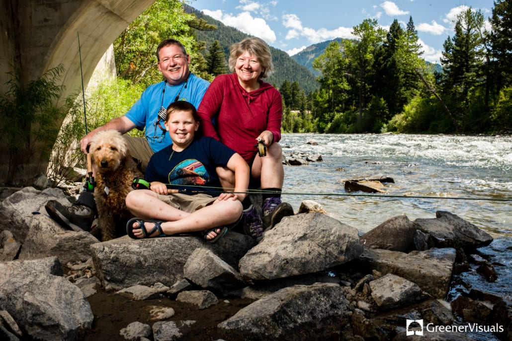 grandparents-with-grandson-under-bridge-during-their-Flyfishing-Family-portrait-session-on-the-Gallatin River