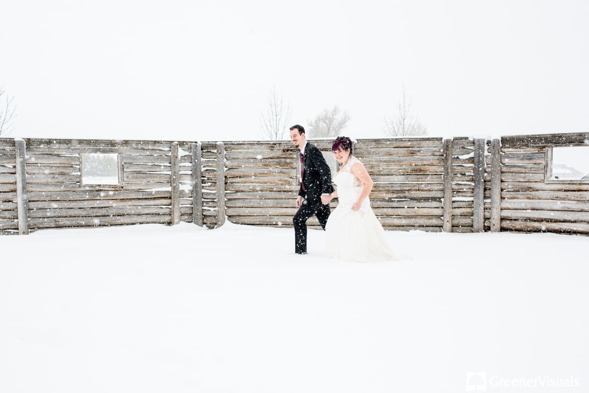 bride-groom-walk-near-barnwood-wall-at-1915-Barn-2019-Best-of-Wedding-Photography