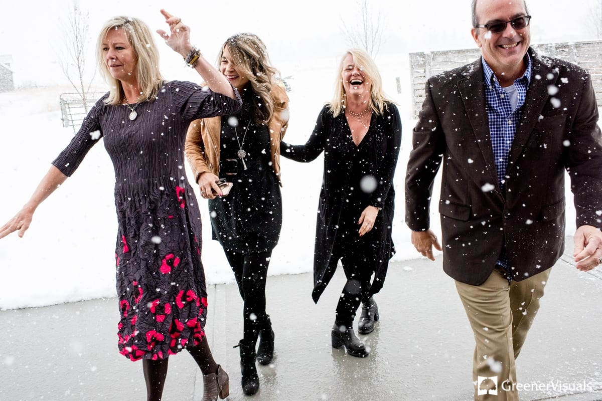 wedding-guests-laugh-and-play-in-snow-2019-Best-of-Wedding-Photography