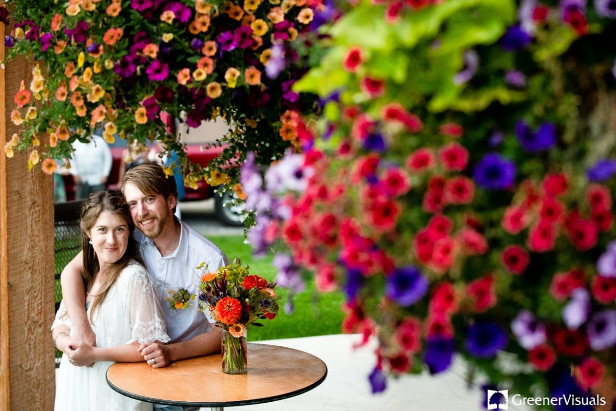 newlyweds-embrace-under-flowers-2019-Best-of-Wedding-Photography