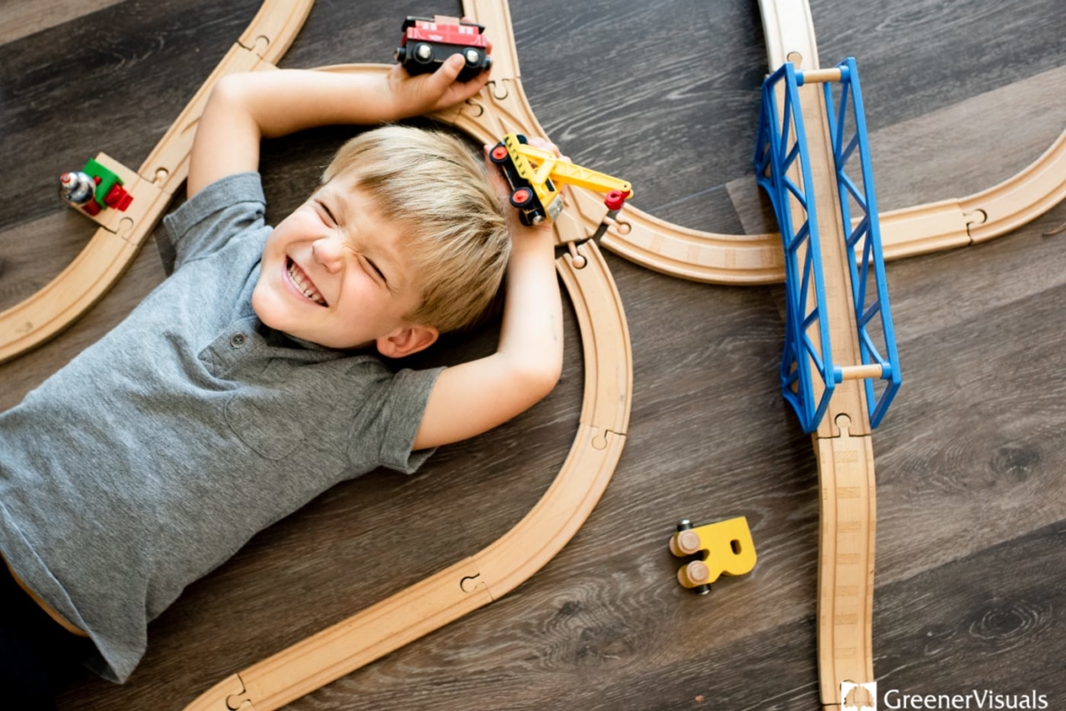 Boy-playing-toy-trains-Family-Portrait-Photography
