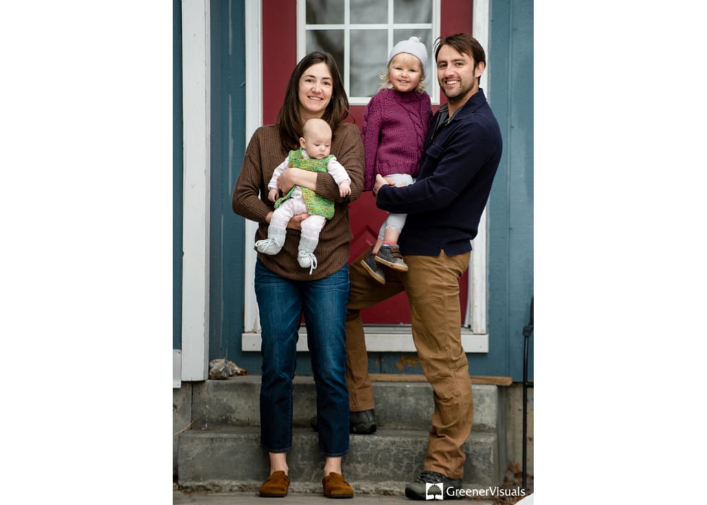 young-parents-holding-daughters-during-Porch-Project-Family-portraits 