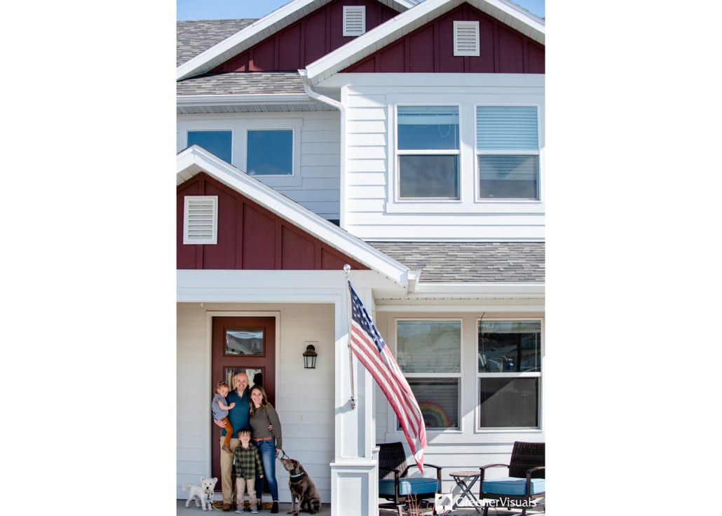 family-portrait-infront-of-white-maroon-house-Front-porch-project