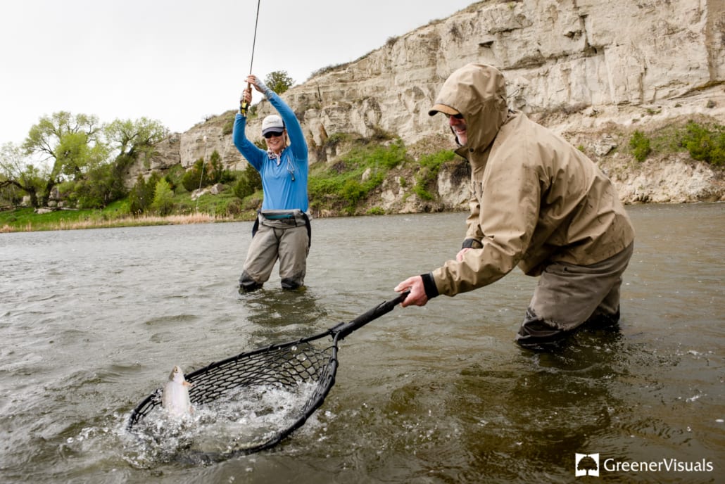 female-angler-guide-landing-trout-Madison-river