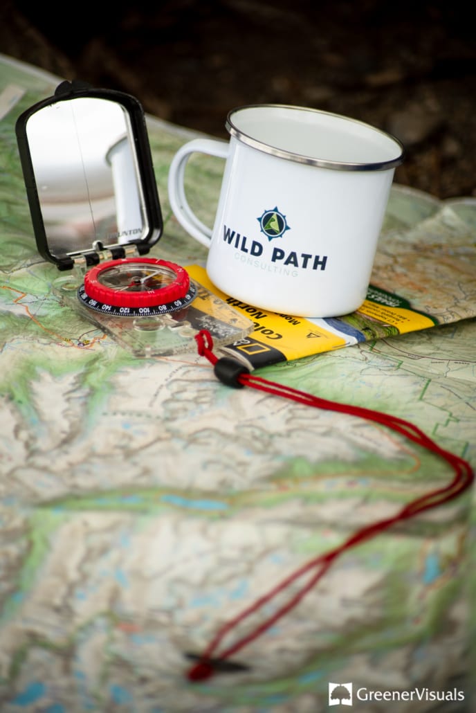 detail-of-compass-mug-and-map-wild-path-consulting