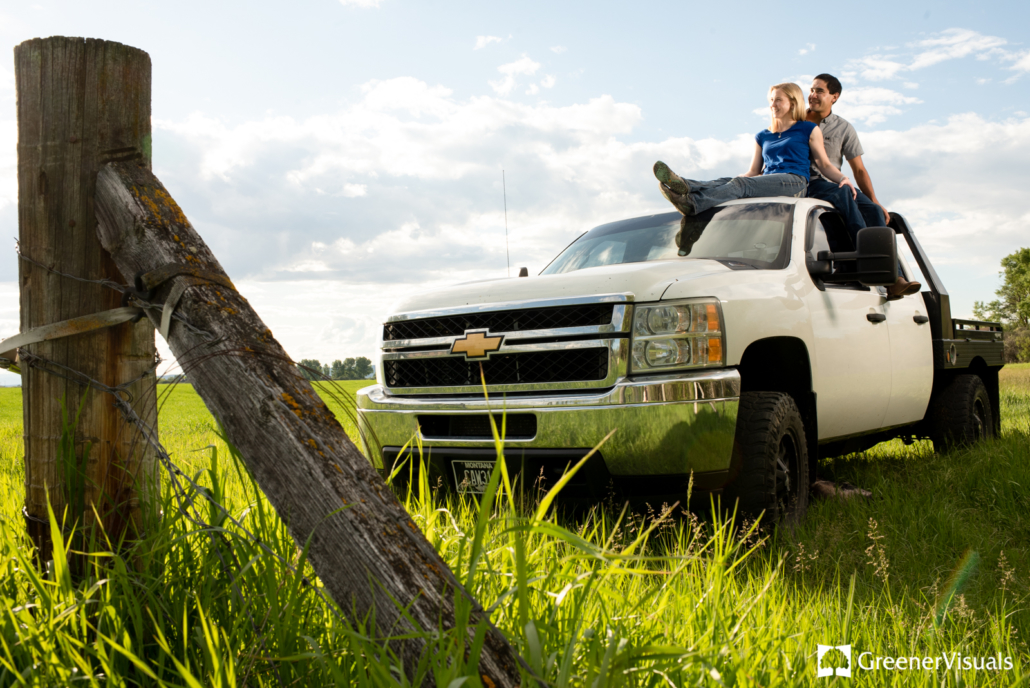 ranching-couple-watch-sunset-sitting-on-chevy-truck