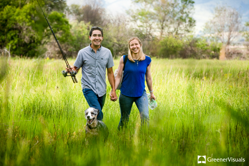 engaged-couple-with-fishing-poles-walk-with-dog-along-East-Gallatin-River