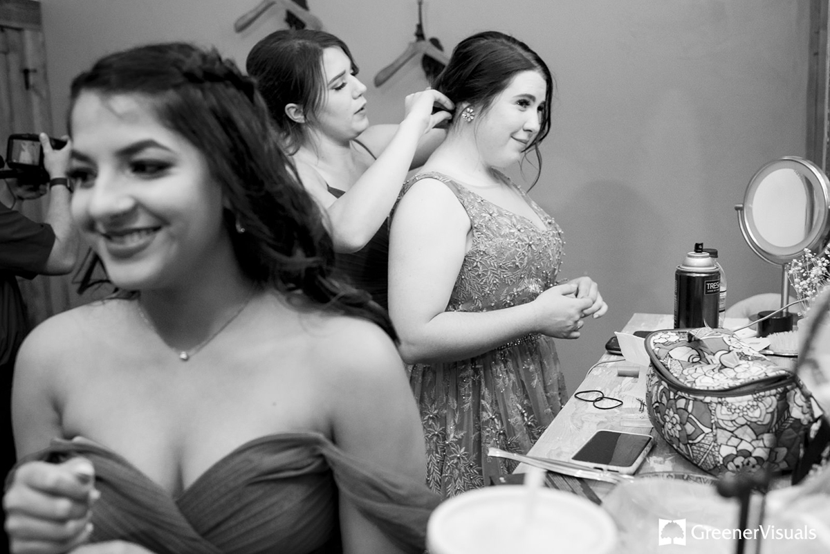 helping-bridesmaids-work-on-hair-styling