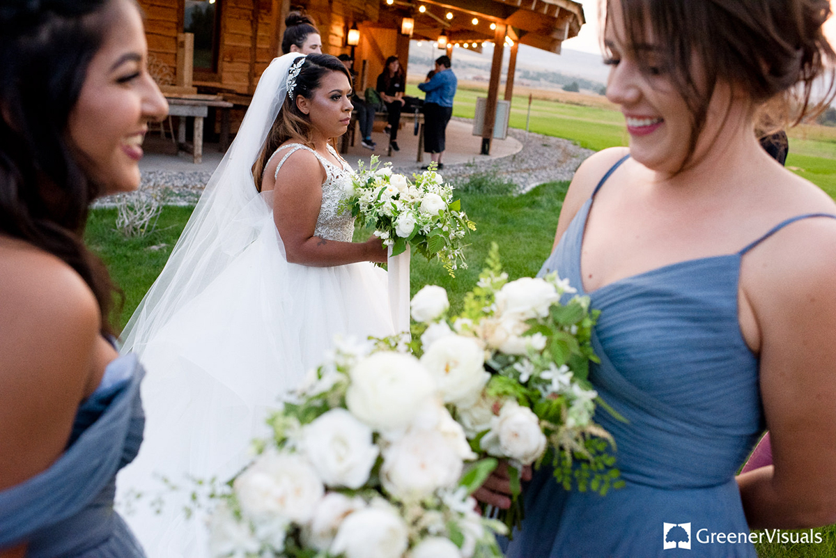 bride-with-bridesmaids-holding-flowers